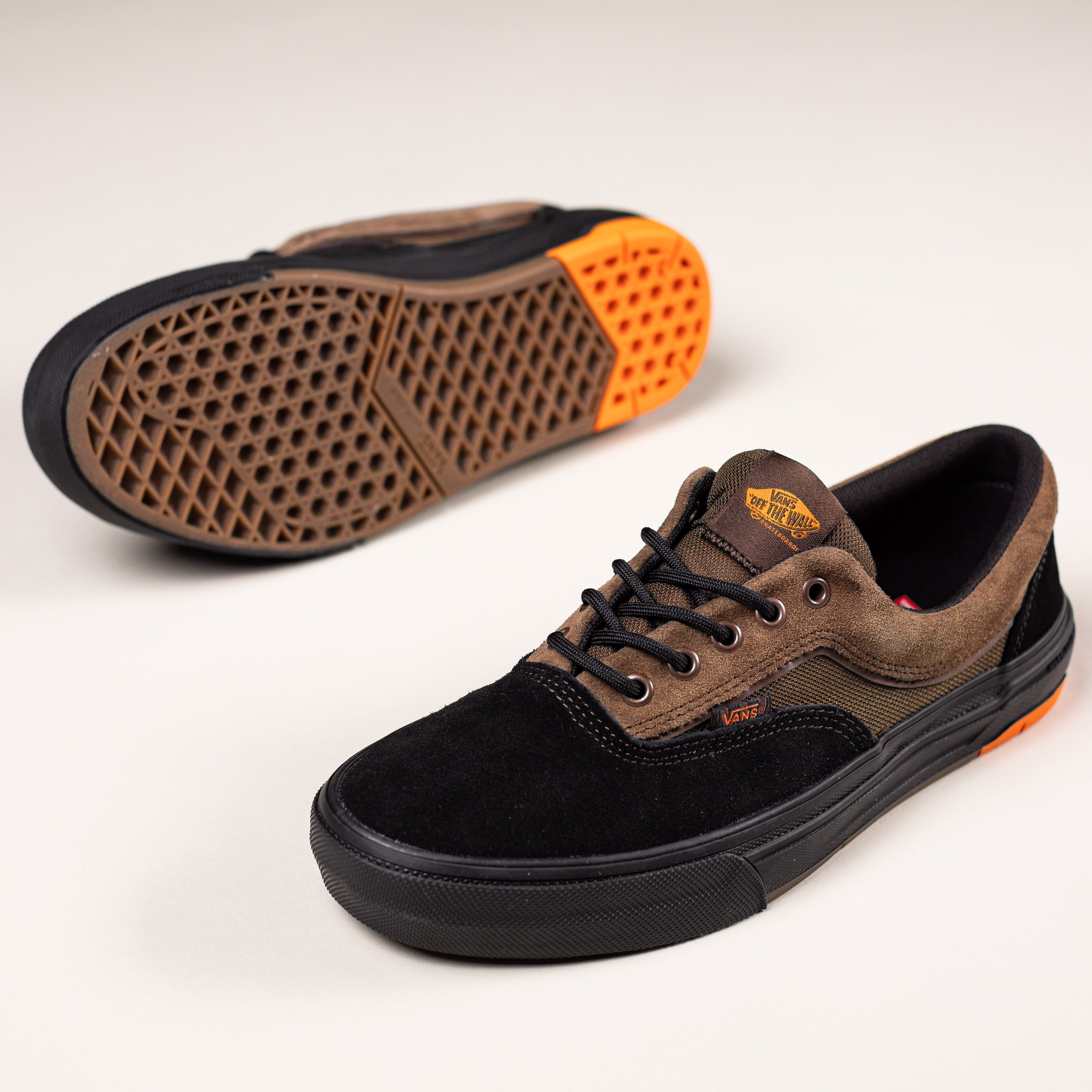 A pair of Vans Skate Era Wafflecup Black White VN000EF0BA21 suede rubber shoes, with Wafflecup construction and textured sole—one upright, the other on its side showing the tread pattern and heel detail.