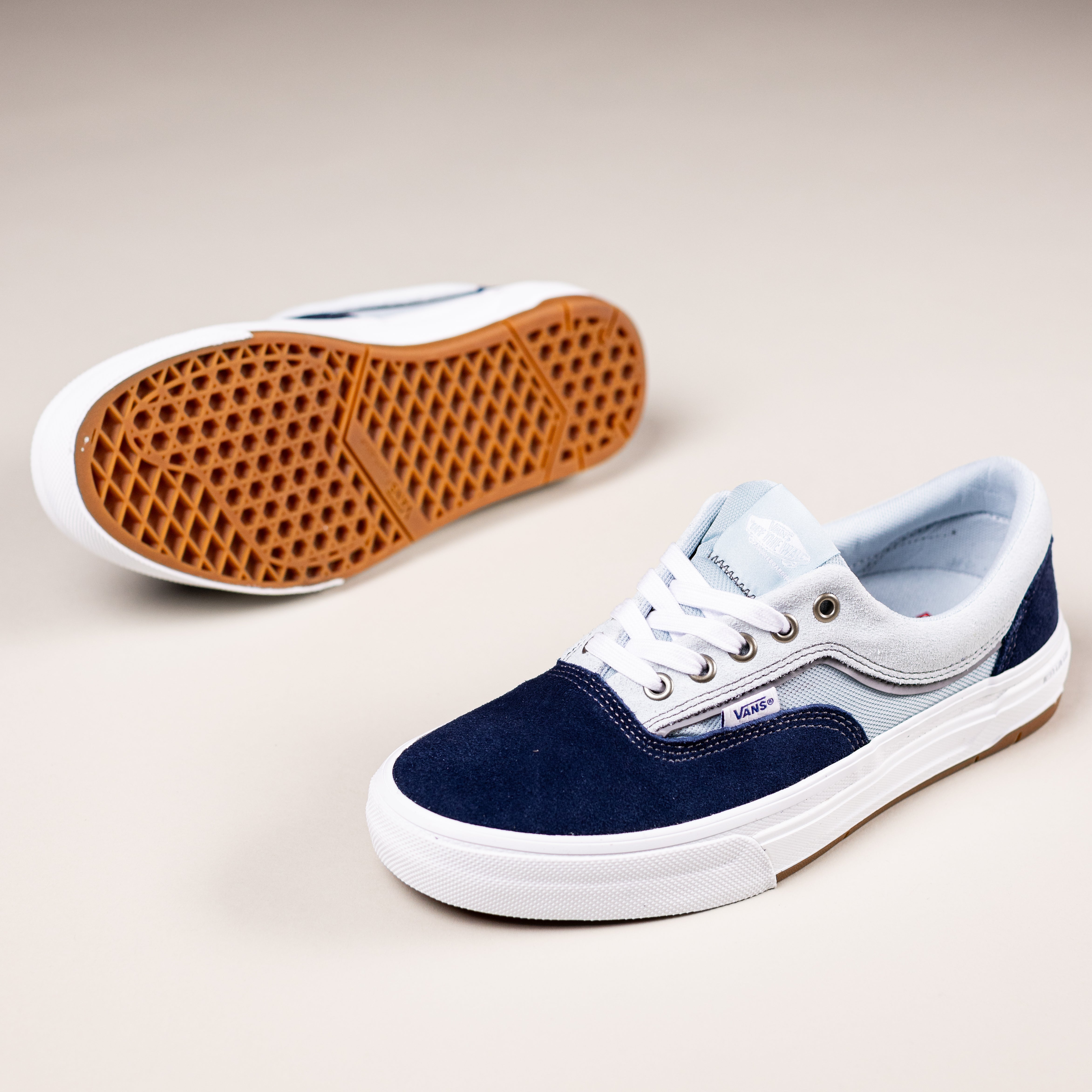 The Vans Skate Era Wafflecup Black White VN000EF0BA21 features suede and rubber construction, with one shoe upright and the other displaying the signature gum rubber Wafflecup tread pattern.