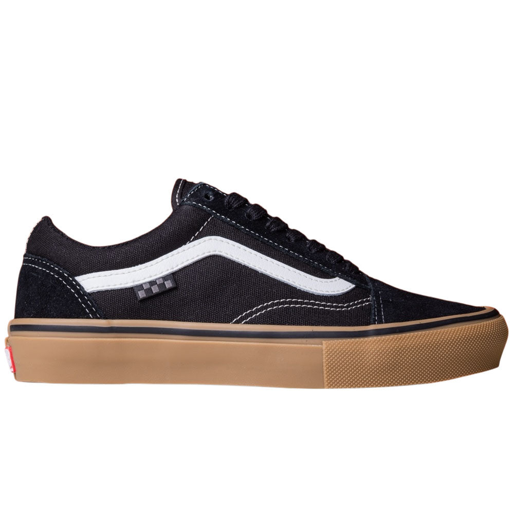 The Vans Skate Old Skool Black Gum White VN000EDNB9K1 features a black and white low-top design, suede upper, brown gum sole, white side stripe, black laces, and a red logo tag—classic skate shoes inspired by Tony Hawk’s Pro Skater.