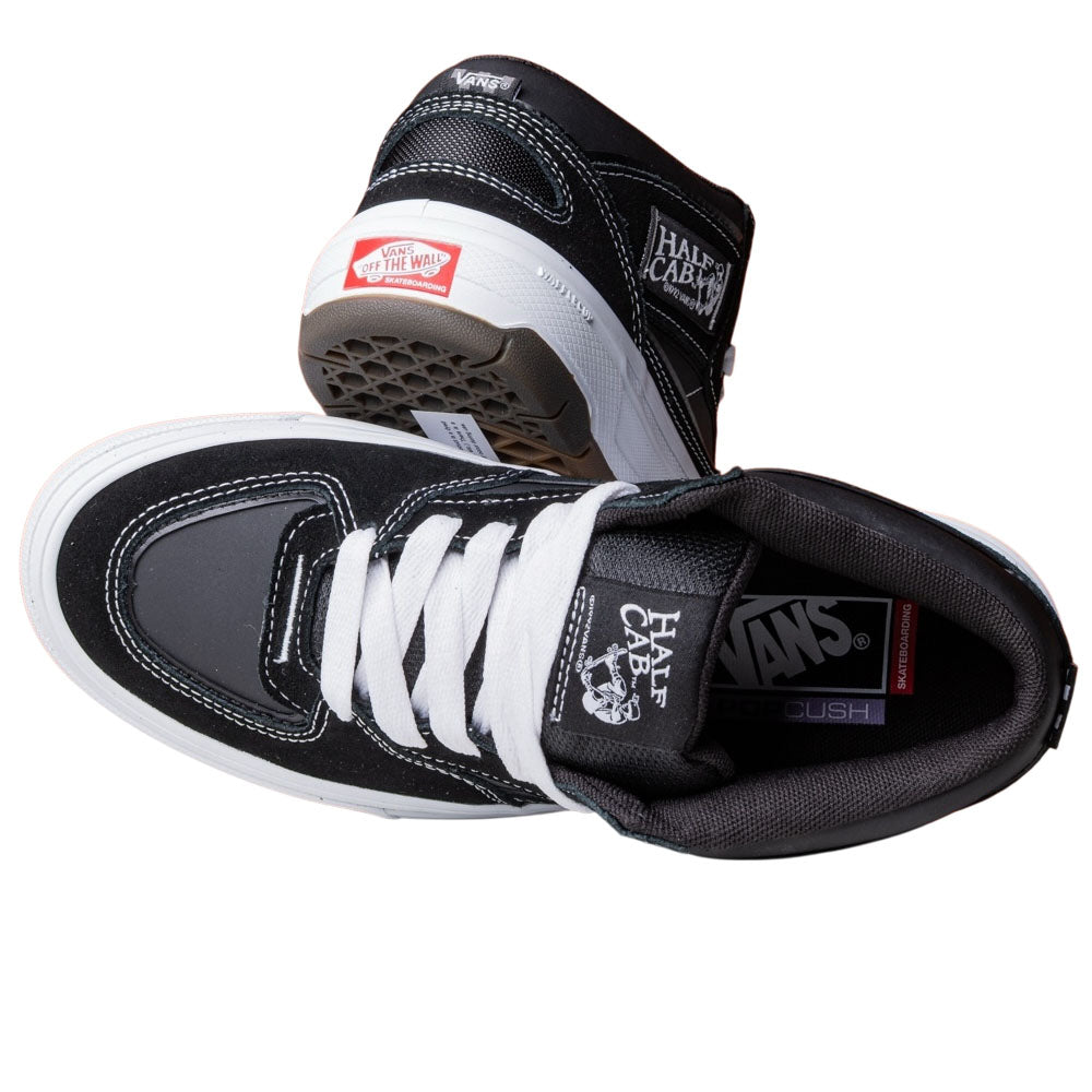 A pair of Vans Wafflecup Half Cab Black White VN000D9ZBA2 suede skate shoes—one showing the Wafflecup sole and heel, the other displaying the top and inside; stylish and high-performance footwear for skating.