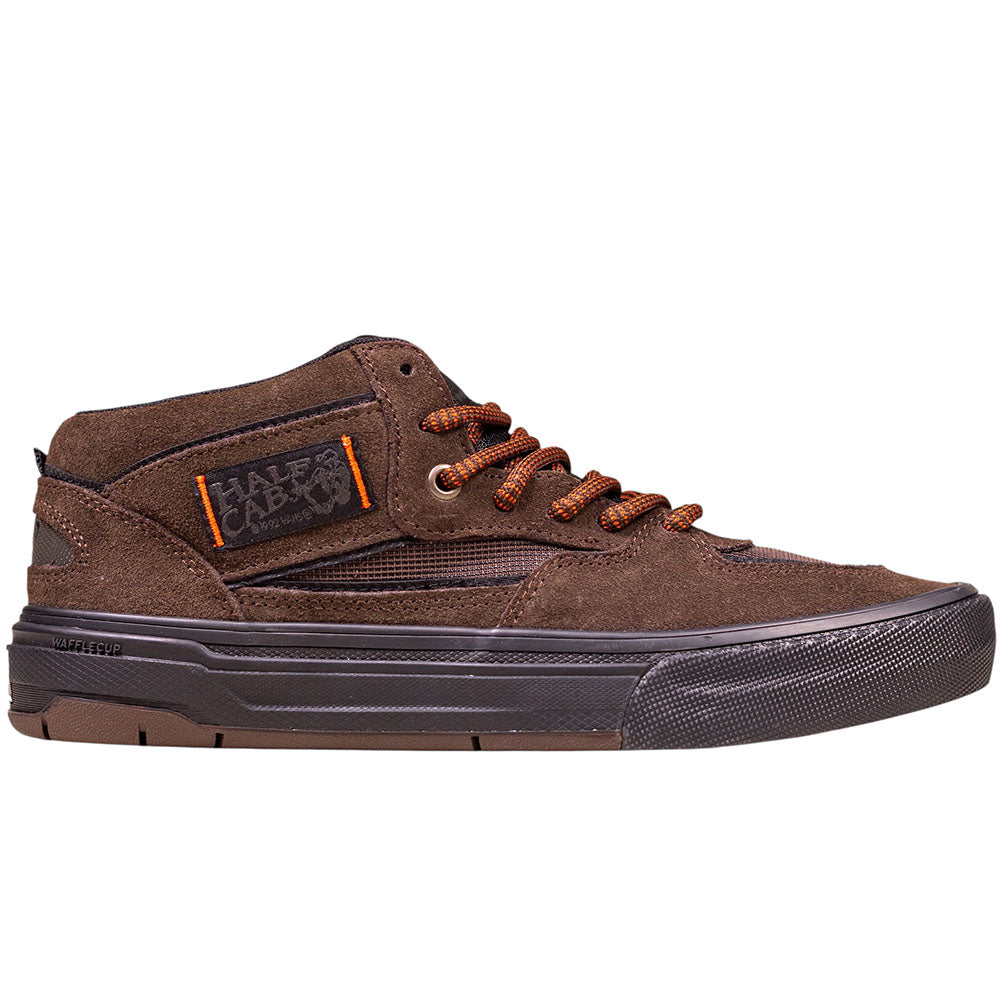 The Vans Wafflecup Half Cab Rizzo Brown Black VN000D9ZY491 suede skate shoes feature brown suede, black details, orange-accented laces, a WaffleCup rubber sole, and a side Vans tag for a stylish and durable mid-top skate option.