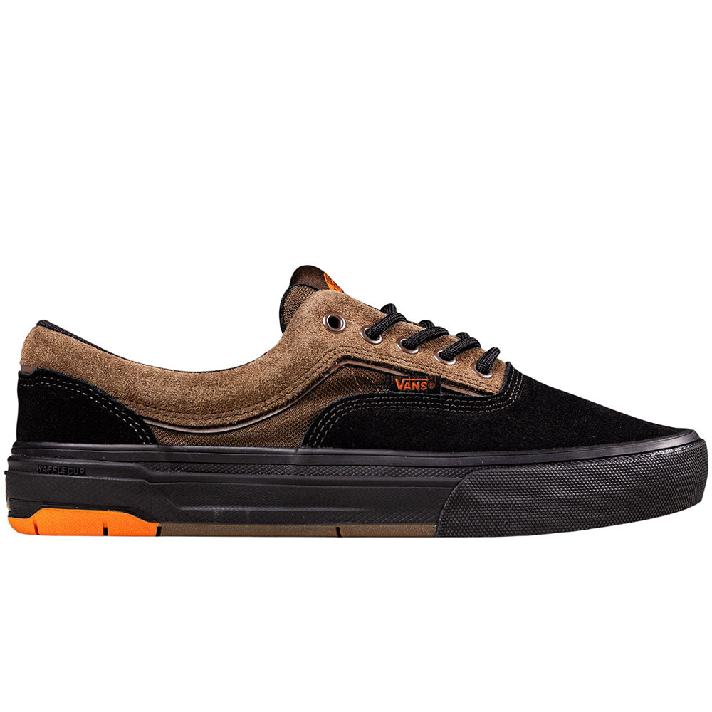 The Skate Era Wafflecup Black White VN000EF0BA21 Vans Suede Rubber Shoes feature a black suede toe and sole, brown suede heel and top, black laces, orange accents, and supportive Wafflecup construction, shown side profile on white background.