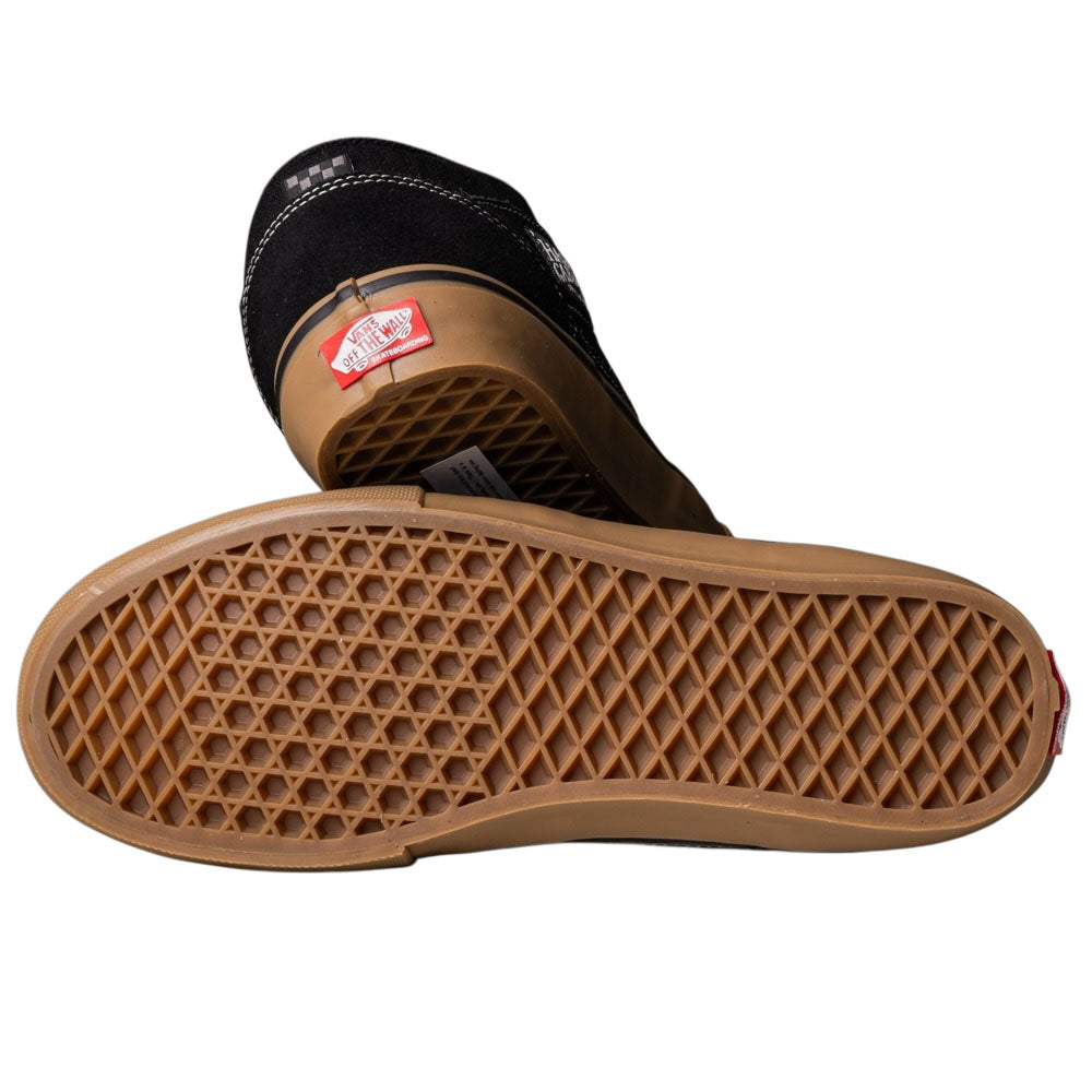 A pair of Vans Half Cab Black Gum White VN0A5FCDB9K suede skate shoes: one upright showing the back logo, the other sideways displaying the brown waffle-patterned sole.
