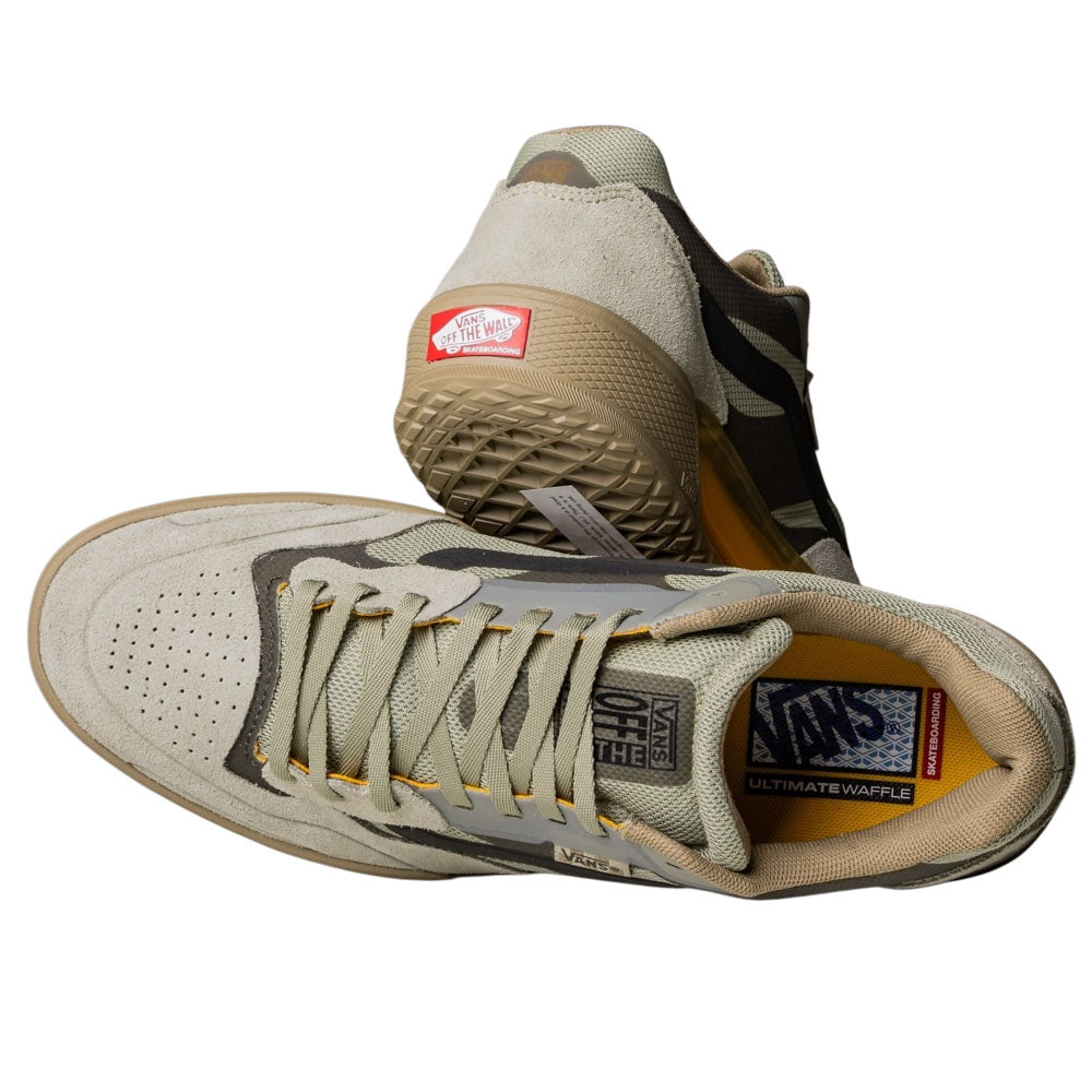 A pair of Vans Skate Ave 2.0 Sage VN000DA1SAG1 Suede Skateboarding Shoes; one shoe lies on its side, showing the UltimateWaffle sole and laces, while the other stands upright, displaying the textured tread and red Vans heel logo.