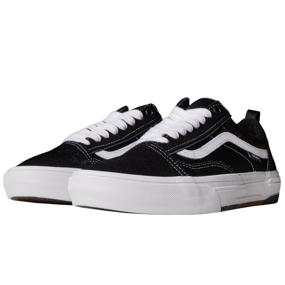 A pair of Vans Wafflecup Old Skool Black White VN000EB7BA2 suede skate shoes featuring a black and white low-top design, white laces, white soles, and a curved white stripe on the side, displayed side by side against a plain background.