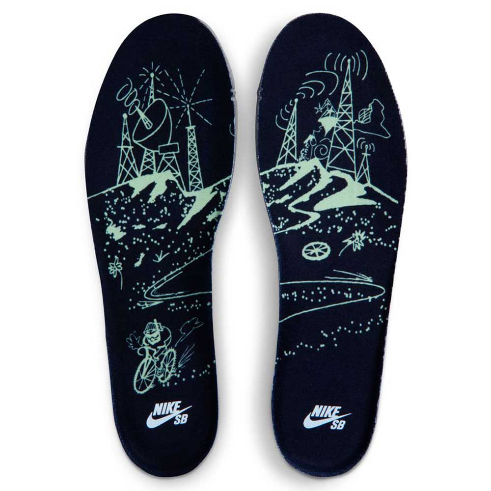 A pair of Verdugo Mountain Dunk Low Pro Nike SB insoles with neon green radio towers, hills, a cyclist, and swirling paths on a dark background, finished with the Nike SB logo at the heel.