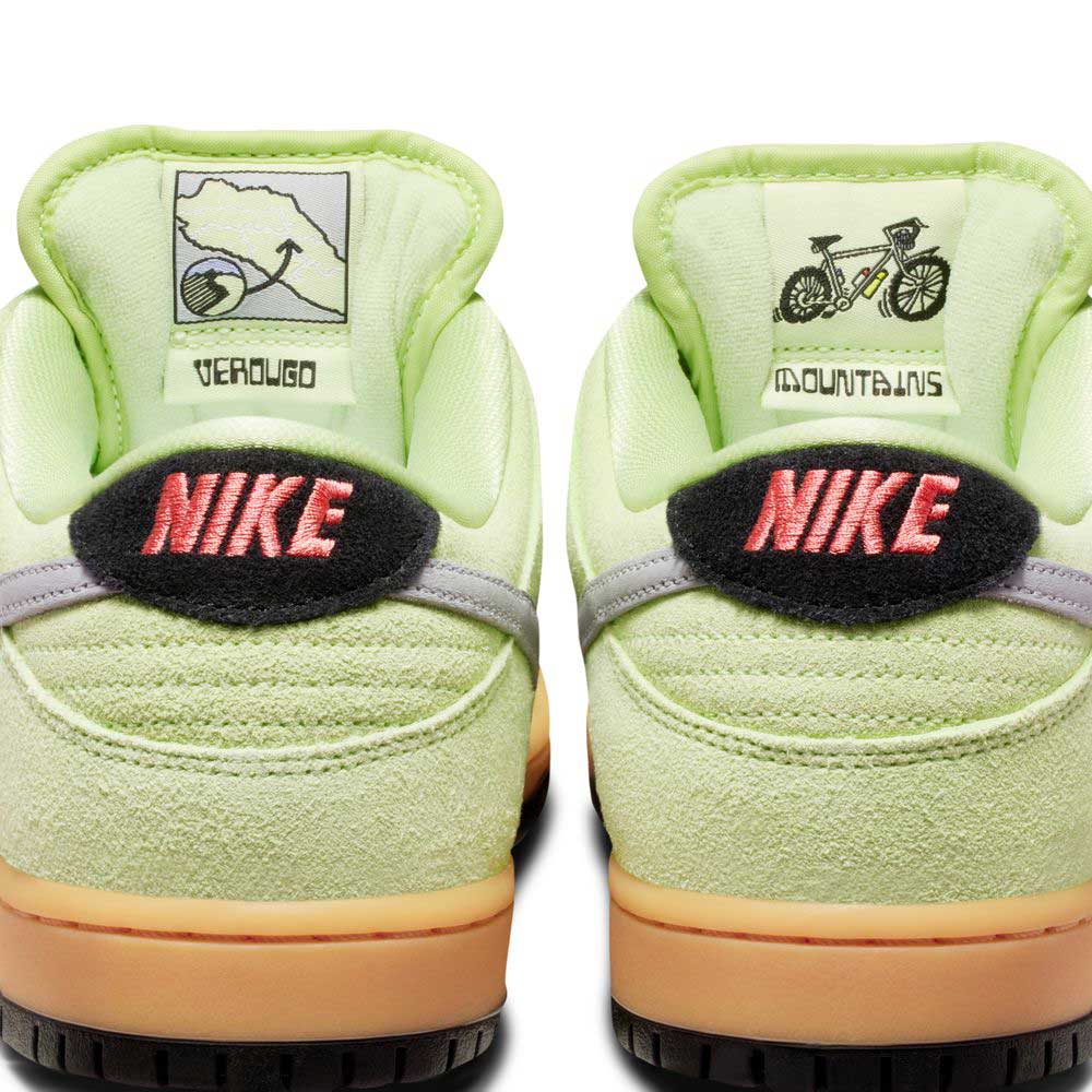 Close-up of the Nike SB Dunk Low Pro “Verdugo Mountain” HQ1626300 in Light Liquid Lime/Wolf Grey/Black suede, featuring pink "NIKE" on black tabs, a map and "Verdugo" on the left heel, and a bicycle and "Mountains" on the right.