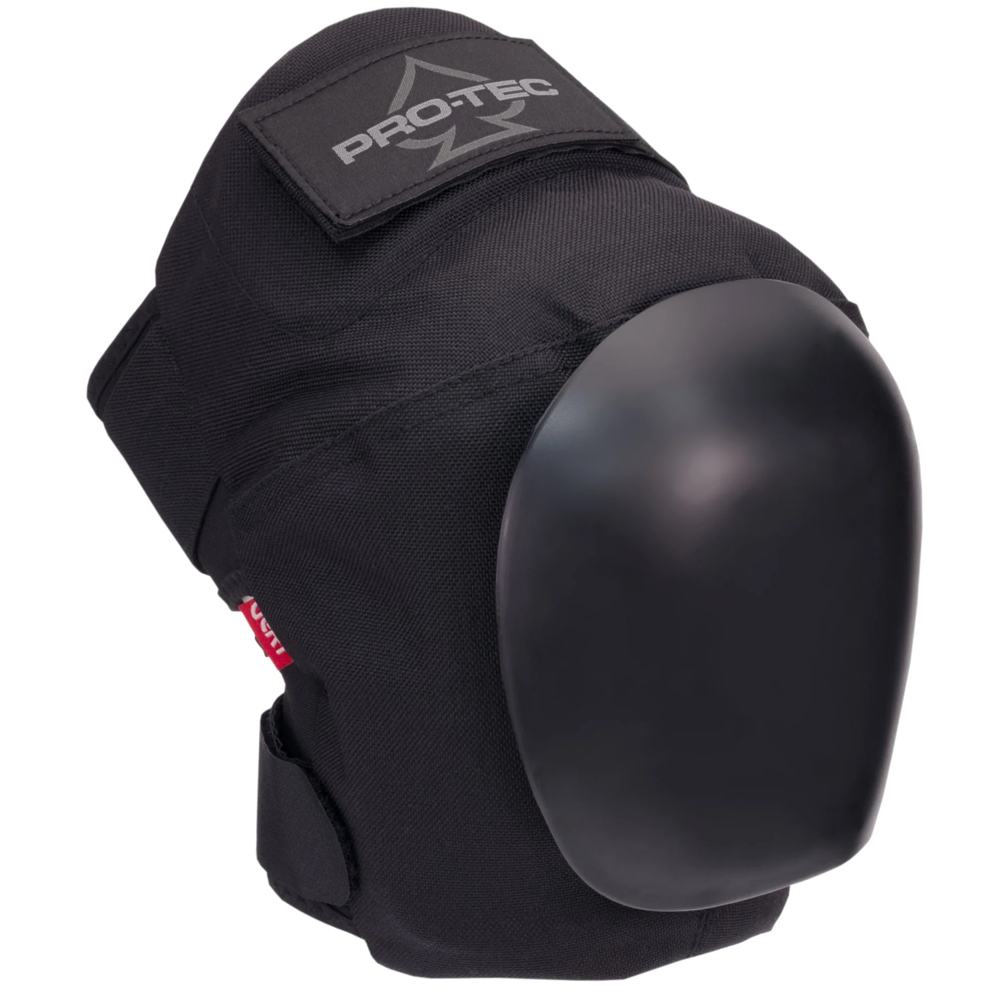 The Vert Knee Pads Protec Black feature a hard, rounded shell, adjustable straps, and the Pro-Tec logo on the upper fabric, providing impact protection during skateboarding and other physical activities.