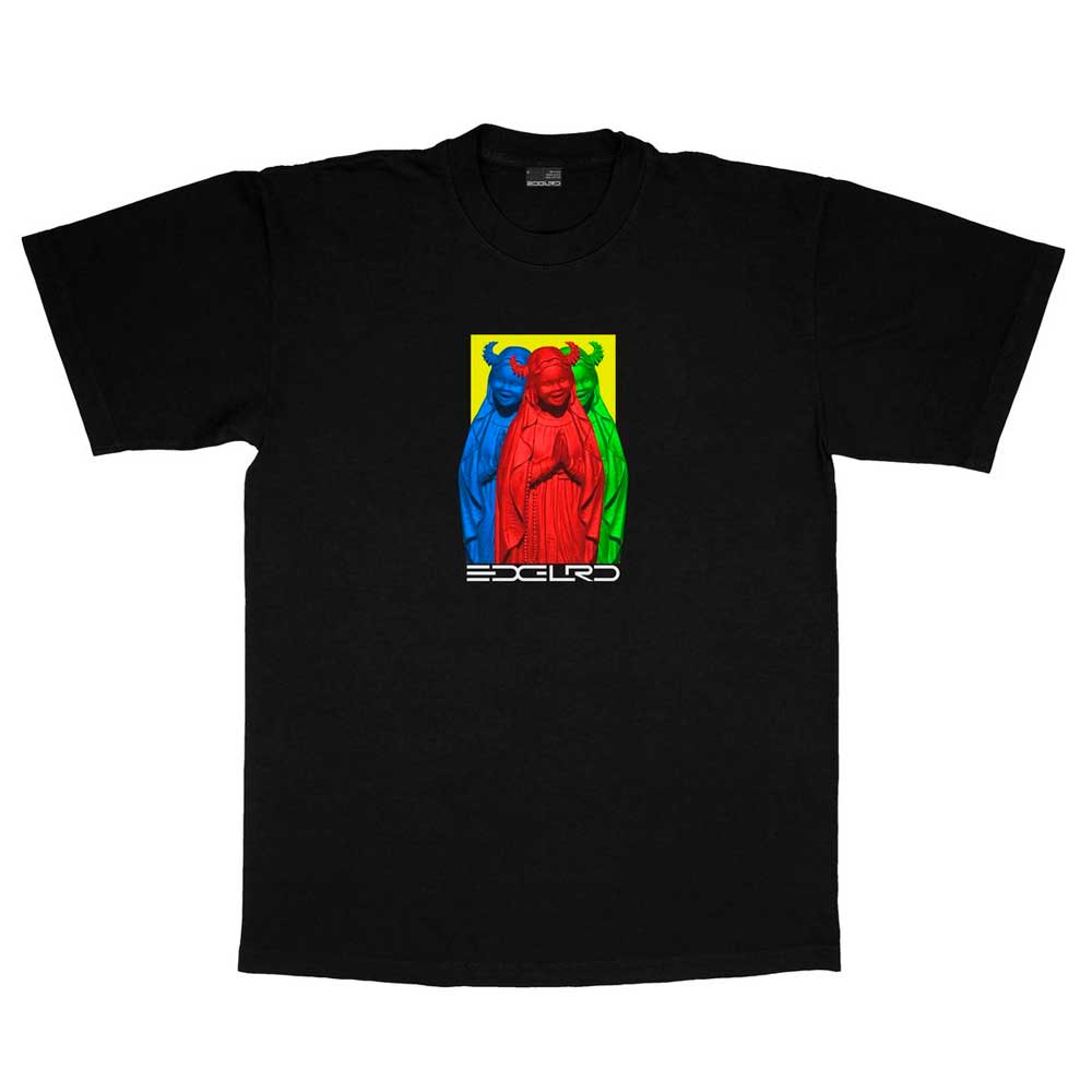 The Virgin Mary Tee Black EDGLRD is a heavyweight cotton T-shirt featuring a screenprint of three colored statues—blue, red, and green—with “ESCUDO” in stylized white text below. Made in the USA.