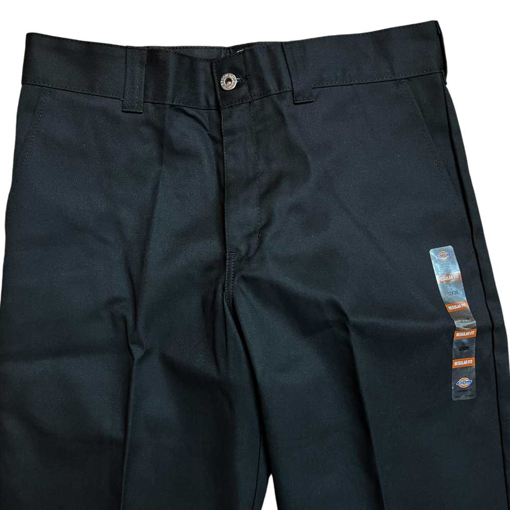A pair of WPSK67BL Black Skateboarding Pant Regular Fit Twill, partially folded to display waistband, button, belt loops, and brand tags—made from durable brushed twill for comfort and style.