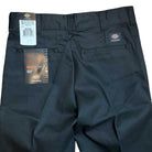 A pair of WPSK67BL Black Skateboarding Pant, size 32x30, Regular Fit. Durable brushed twill, new with tags. Back pockets and logo patch visible—ideal for skateboarding.