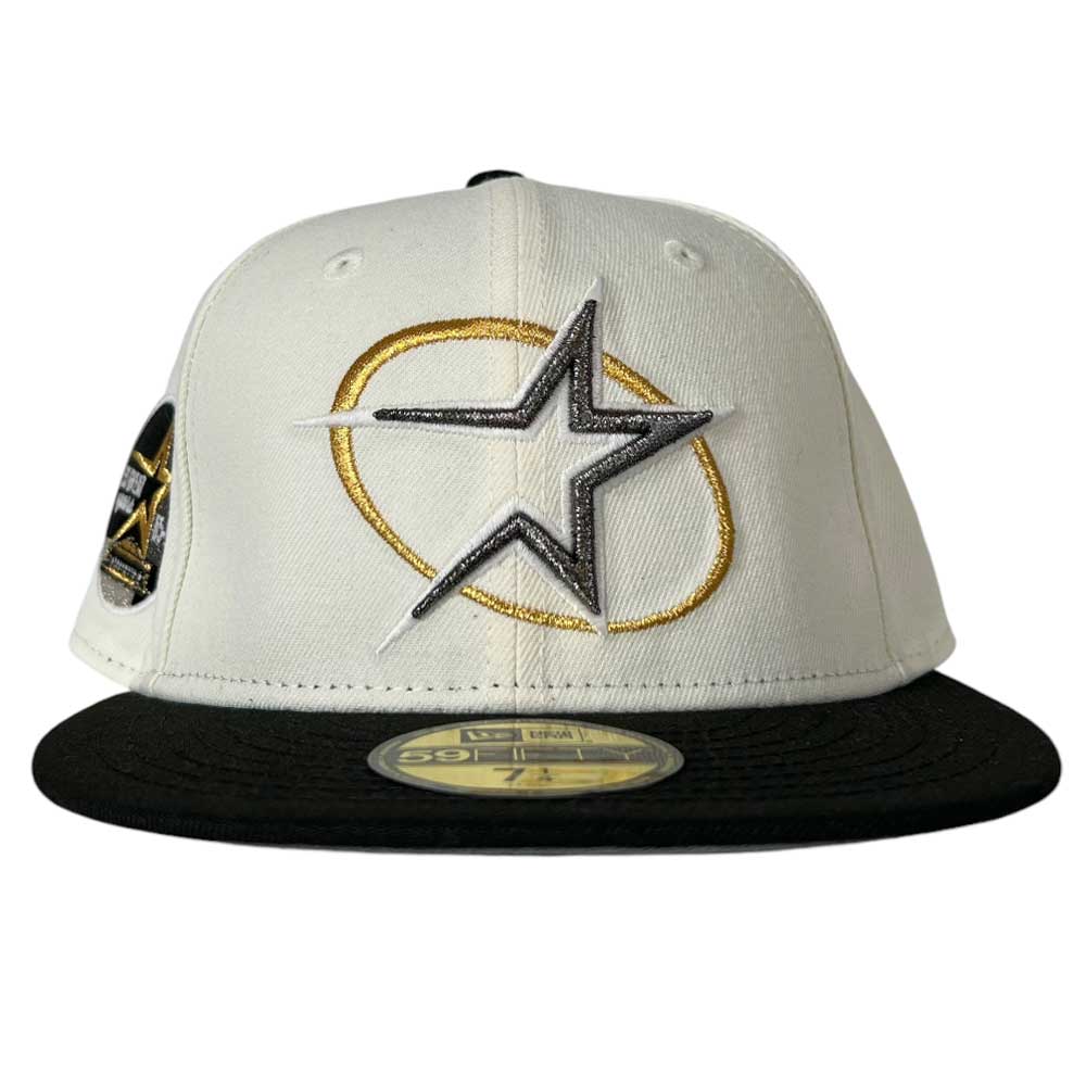 A white and black Houston Astros baseball hat with a star logo and a circular emblem on the front.