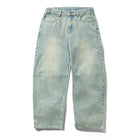 Wide Cut Tinted Blue Wash Denim Jeans by Butter Goods—loose fit with front pockets, belt loops, visible knee seams, and a faded blue wash. Shown laid flat on a white background for classic denim style.