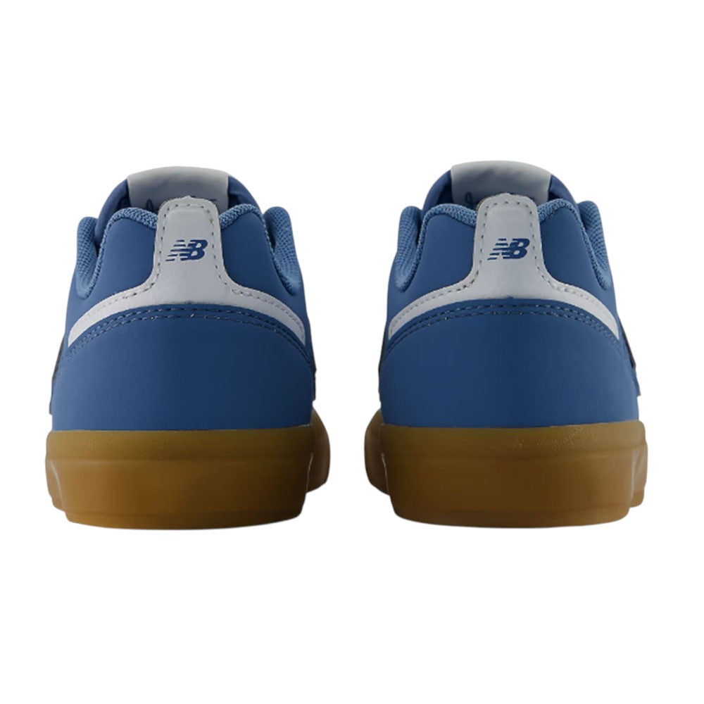 A pair of blue YOUTH Jamie Foy Cup 306 CAR New Balance Numeric Suede Skateboarding Shoes viewed from the back, featuring white accents and gum-colored soles—these durable sneakers are inspired by youth skate shoes, combining style and performance.
