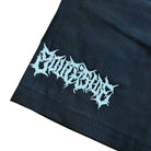 A close-up of black fabric from the YOUTH Texas Icon Black Southside 94 Shorts features light blue, spiky, stylized embroidery spelling EMOTIONS near the hem.