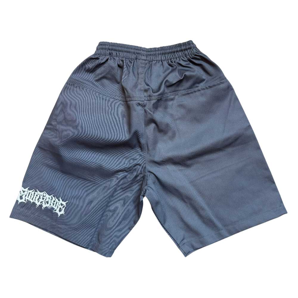 The YOUTH Texas Icon Gray Southside 94 Shorts are loose-fitting, dark gray skate shorts with an elastic waistband and a white logo near the left hem, shown laid flat on a white background.