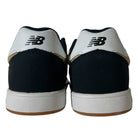 The YOUTH YS425 BNT Black White Tan New Balance Numeric suede skateboarding shoes feature black and white panels, a suede upper, and the New Balance logo on the heel—perfect for skating in style.