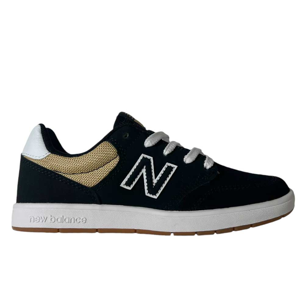 The YOUTH YS425 BNT by New Balance Numeric is a black suede skateboarding shoe with white laces, a white sole, a white N logo, tan mesh detail near the heel, and a brown rubber outsole.