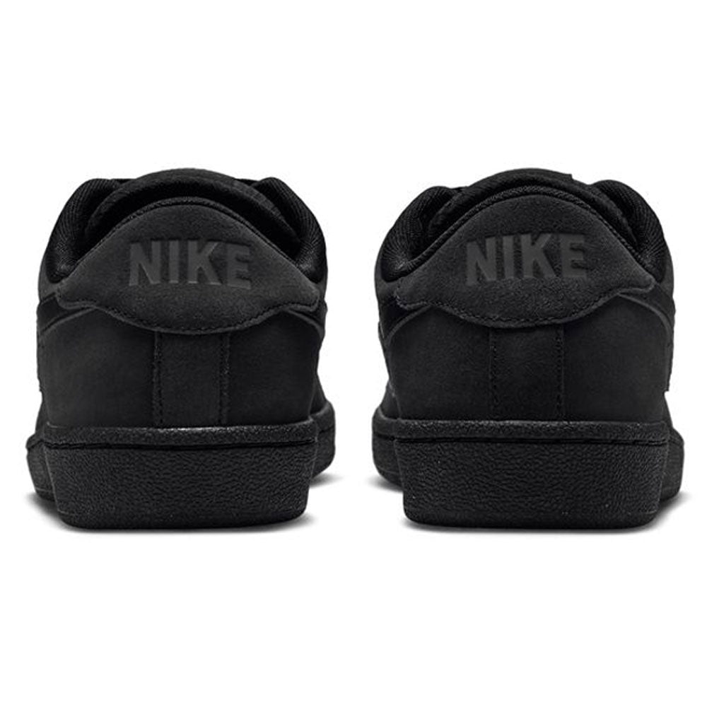 Back view of Zoom Tennis Classic HF7386003 Black Black Suede Nike SB Skateboarding Shoes, showing a tennis-inspired leather sneaker with the word NIKE embossed on the heel tabs.