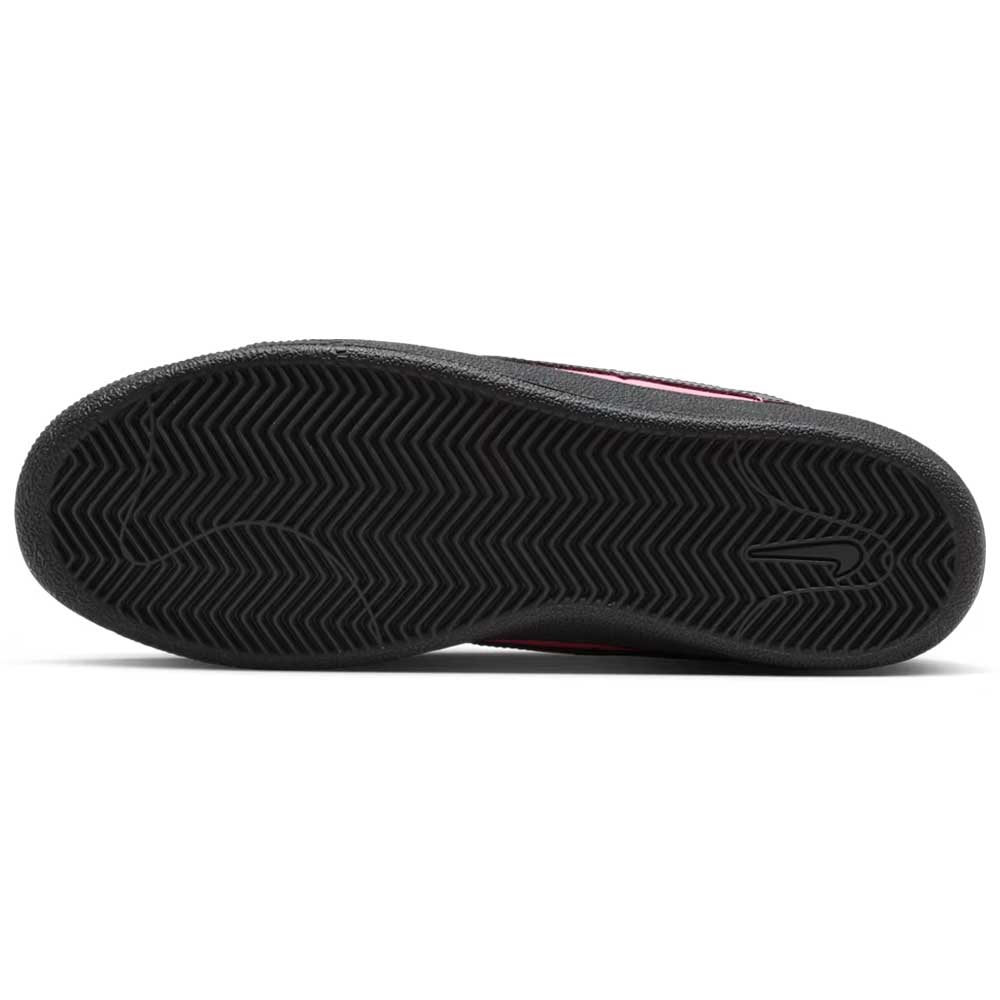 Close-up view of the black rubber outsole on the Nike SB Zoom Tennis Classic IO8394600 Hyper Pink Black Leather Skateboarding Shoes, featuring a herringbone tread pattern and an embossed swoosh logo near the heel.