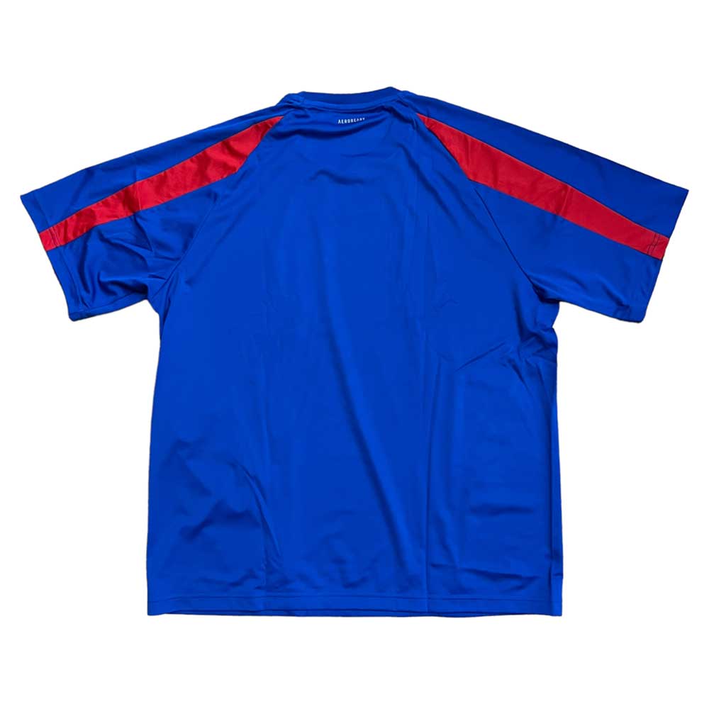 An Adidas Jersey CL Royal Blue Red Embroidered, featuring short sleeves and red stripes on the shoulders, is laid flat with its back facing up.