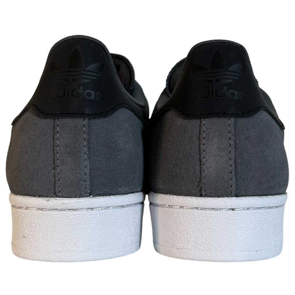Back view of Superstar ADV Adidas Grey Black Suede Shoes with white soles, black heel tabs, reflective badging, and Adidas logo.