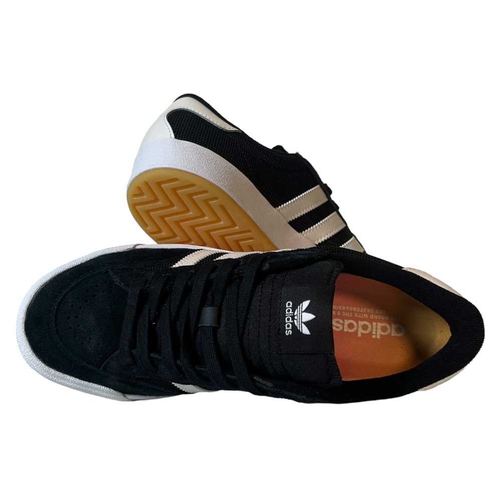 A pair of Adidas Nora Black Zero Spark Suede Knit Shoes, featuring white stripes and soles. One shoe shows its side and sole, the other displays the insole logo—ideal for fans of vintage skate style.