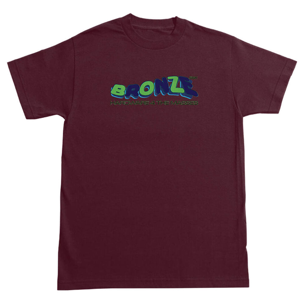 The Bronze 56K Tee Blaze Burgundy is a short-sleeve shirt with "BRONZE 56K" in green and blue bubble letters and "HARDWARE FOR THE MASSES" in small green text beneath—ideal for Tee Blaze fans.