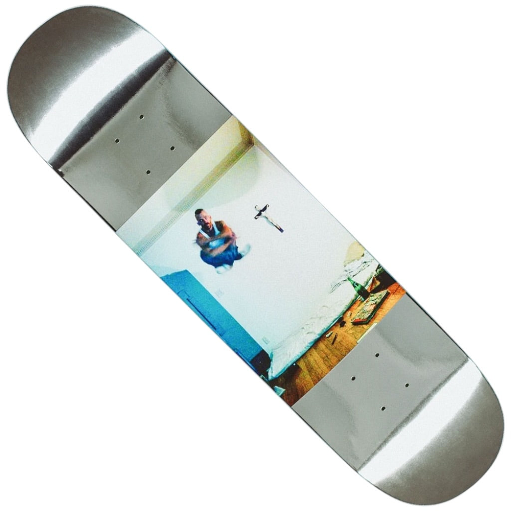The Levitation Jason Dill 8.18x31.73 FA Deck features art of a person mid-air above a bed in a messy, wooden-floored room with scattered objects, cross on the wall, and includes a stable 14" wheelbase.