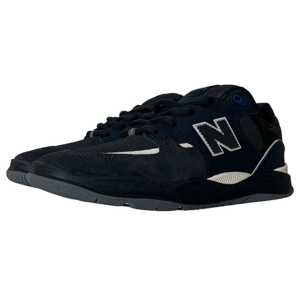 A pair of navy and white New Balance Numeric 1010 UR Tiago Lemos suede shoes, featuring the signature N logo, mesh and suede skate shoe material, and white soles. The shoes are positioned at an angle on a white background.