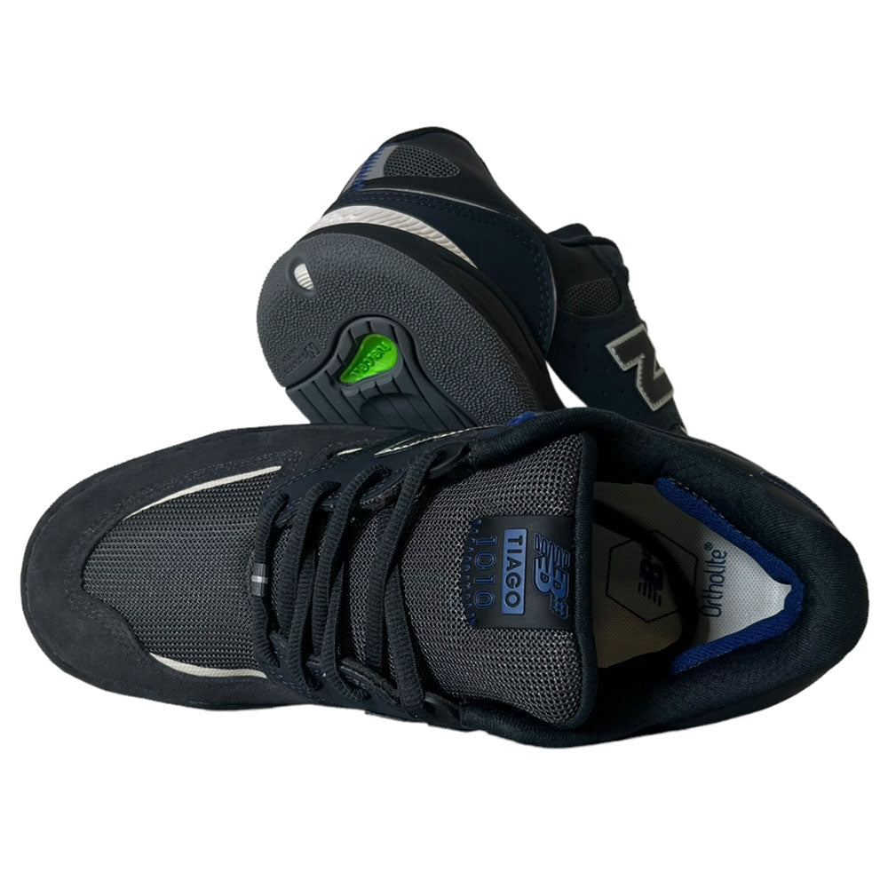 A pair of 1010 UR New Balance Numeric Tiago Lemos Suede Shoes in navy white shown from the top and side, featuring a mesh and suede upper, lace-up design, and green sole detail—premium skate shoes for style and performance.