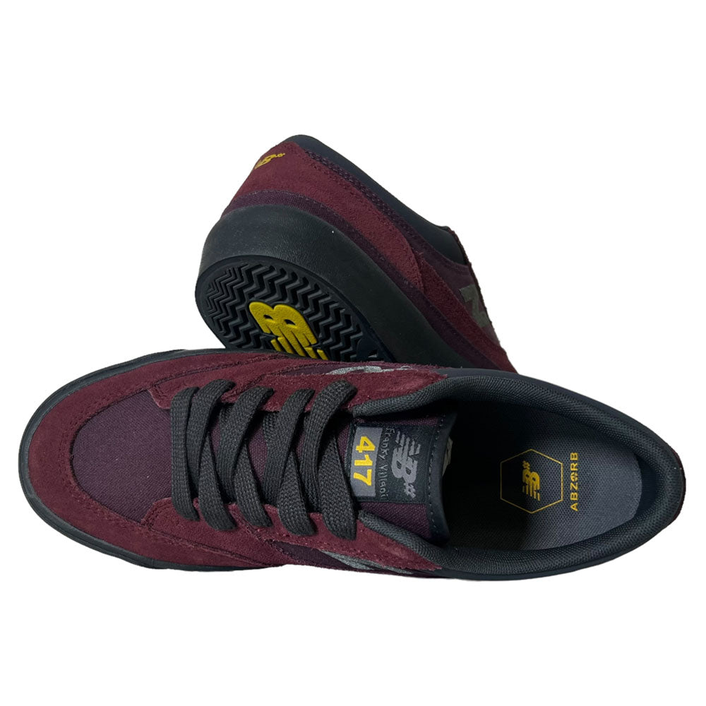 A pair of New Balance Numeric 417 WBP Franky Villani Eggplant Black Suede Skateboarding Shoes, shown from above and the side, featuring yellow branding on the tongue and insole with black soles and laces.