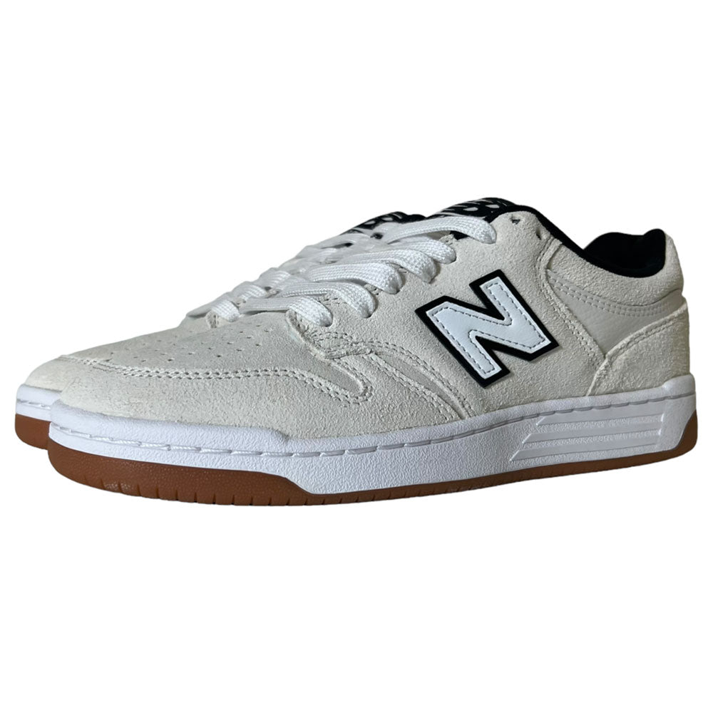 A pair of 480 SWG New Balance Numeric Shoes in suede white with black accents, white laces, gum rubber soles, a FuelCell midsole, and the signature N logo on the sides, displayed against a plain background.