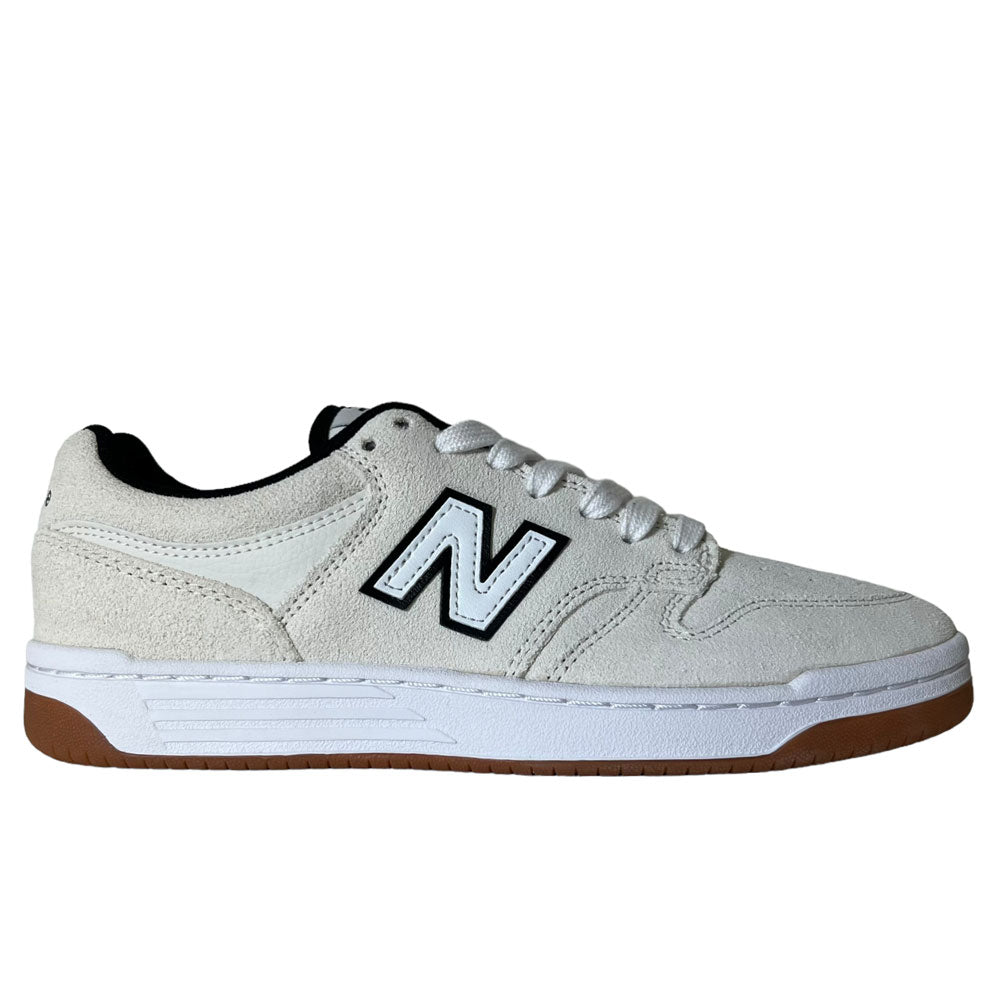 The 480 SWG New Balance Numeric Shoes feature suede in white and black, a black and white N logo, white laces, FuelCell midsole, and brown rubber outsole, shown in side profile on a white background.