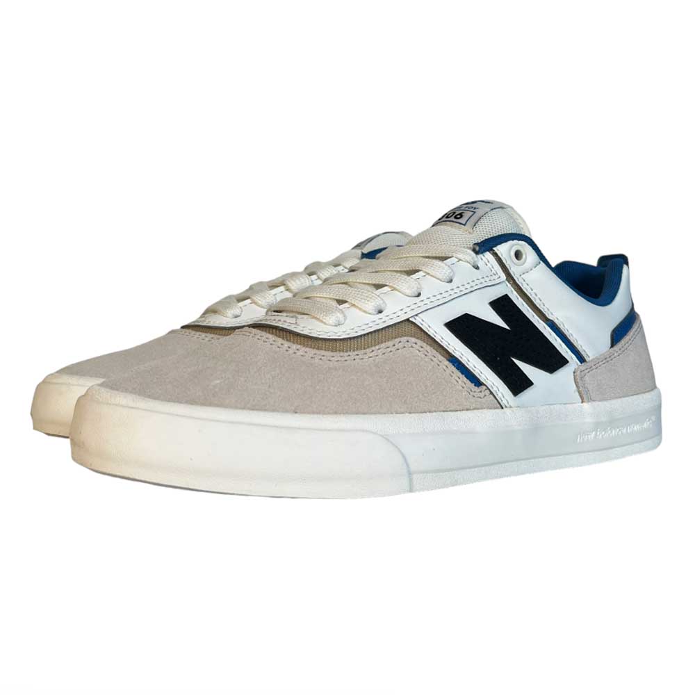 A pair of 306 TWC Jamie Foy New Balance Numeric suede shoes featuring beige (brown) uppers, white laces, navy blue side logos, blue and black collar accents, Jamie Foy tongue branding, and white soles.