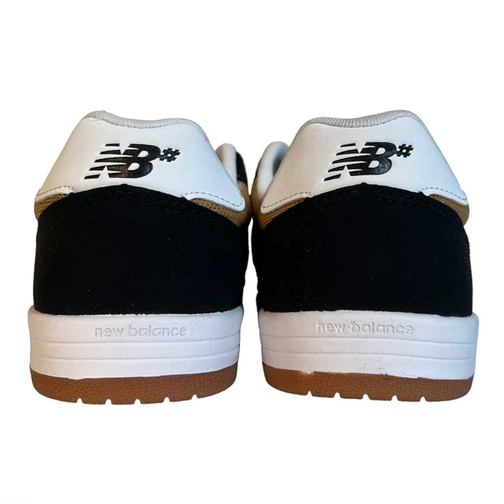 A pair of 425 BNT New Balance Numeric Suede Shoes viewed from the back, featuring a black and white heel design, white soles, C-CAP midsole cushioning, and the New Balance logo on the heel tabs.