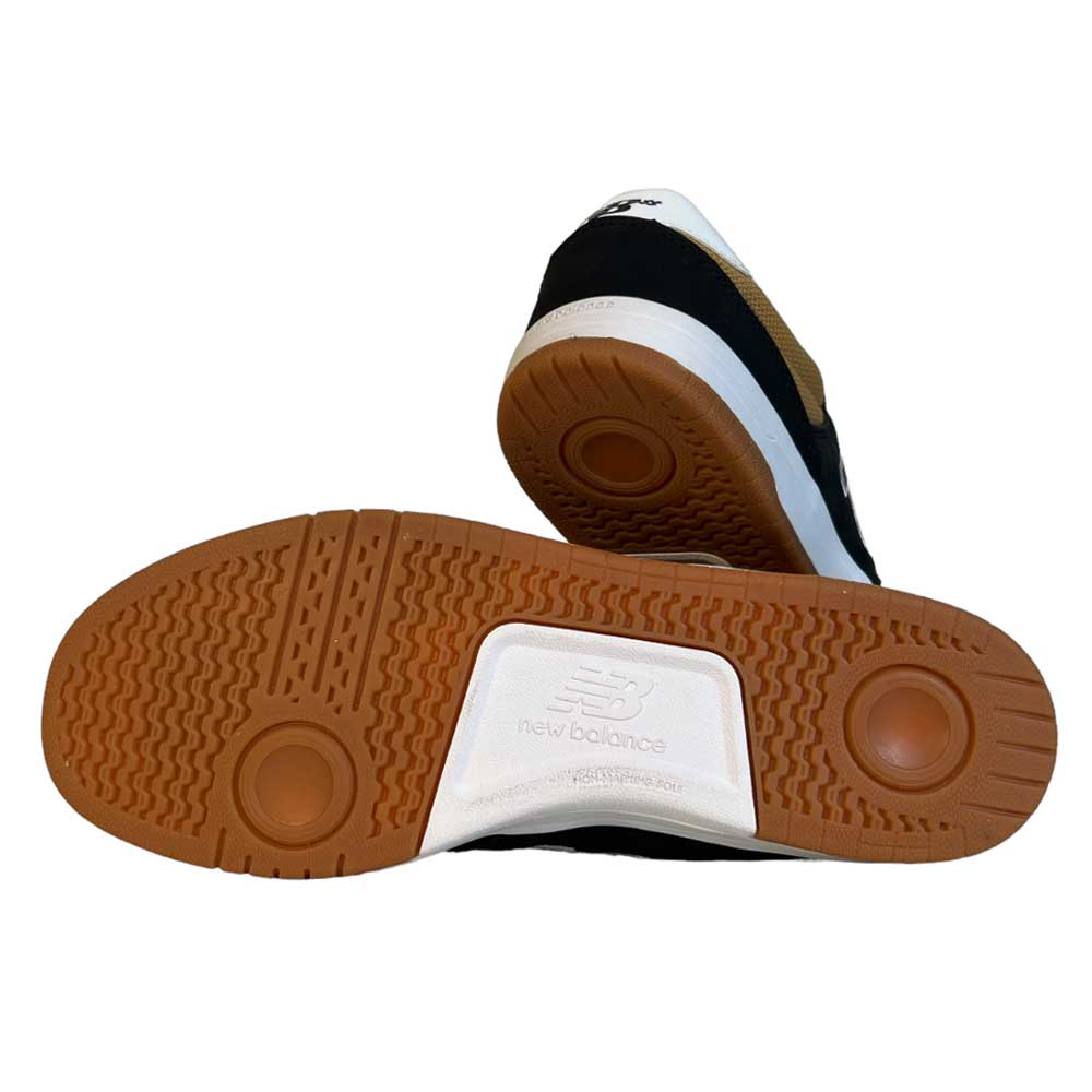 The 425 BNT New Balance Numeric Suede Shoes are displayed, one upright and one on its side, showing the brown gum rubber outsole with circular tread and a white section featuring the New Balance logo.