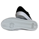 The Standard Low Opus Footwear Black White Suede Shoes feature a black and white suede design, with one shoe on its side displaying the white herringbone-patterned sole and OPUS embossed near the heel.