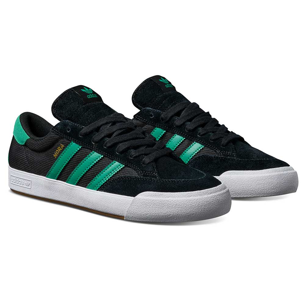 The JH8143 Nora Black Green Suede Adidas Skateboarding Shoes feature green stripes, white midsoles, rubber outsoles, and vintage-inspired design with Adidas logos on the tongue and heel.