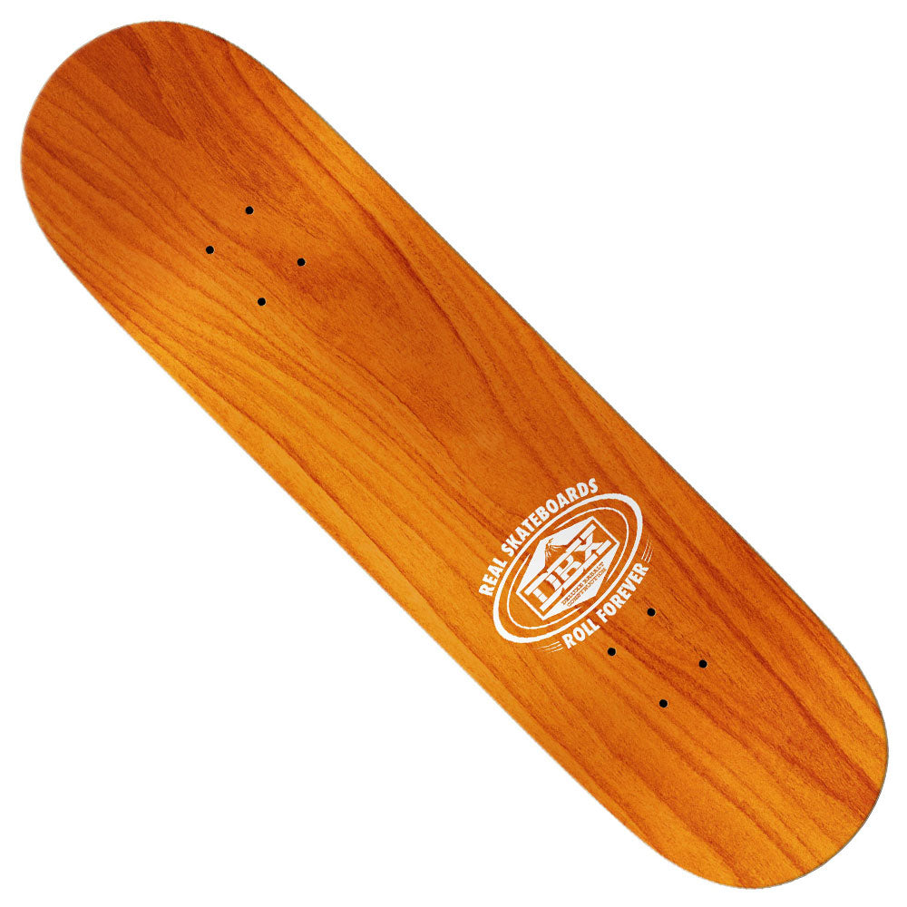 The Basalt Construction DBX 8.5x31.7 Oval Silver Foil Real Skateboard Deck is a lightweight, natural wood-finish deck featuring a white REAL SKATEBOARDS ROLL FOREVER logo, inspired by DBX decks and sold without wheels or trucks.
