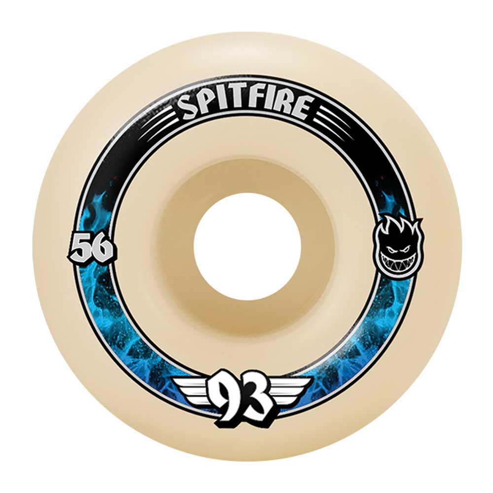 The Spitfire Wheels Radial 56mm 93A Soft Sliders feature a beige design with SPITFIRE branding, blue flames, the number 56 left, a black cartoon face right, and "93 with wings" below—ideal for all-terrain skateboard setups.