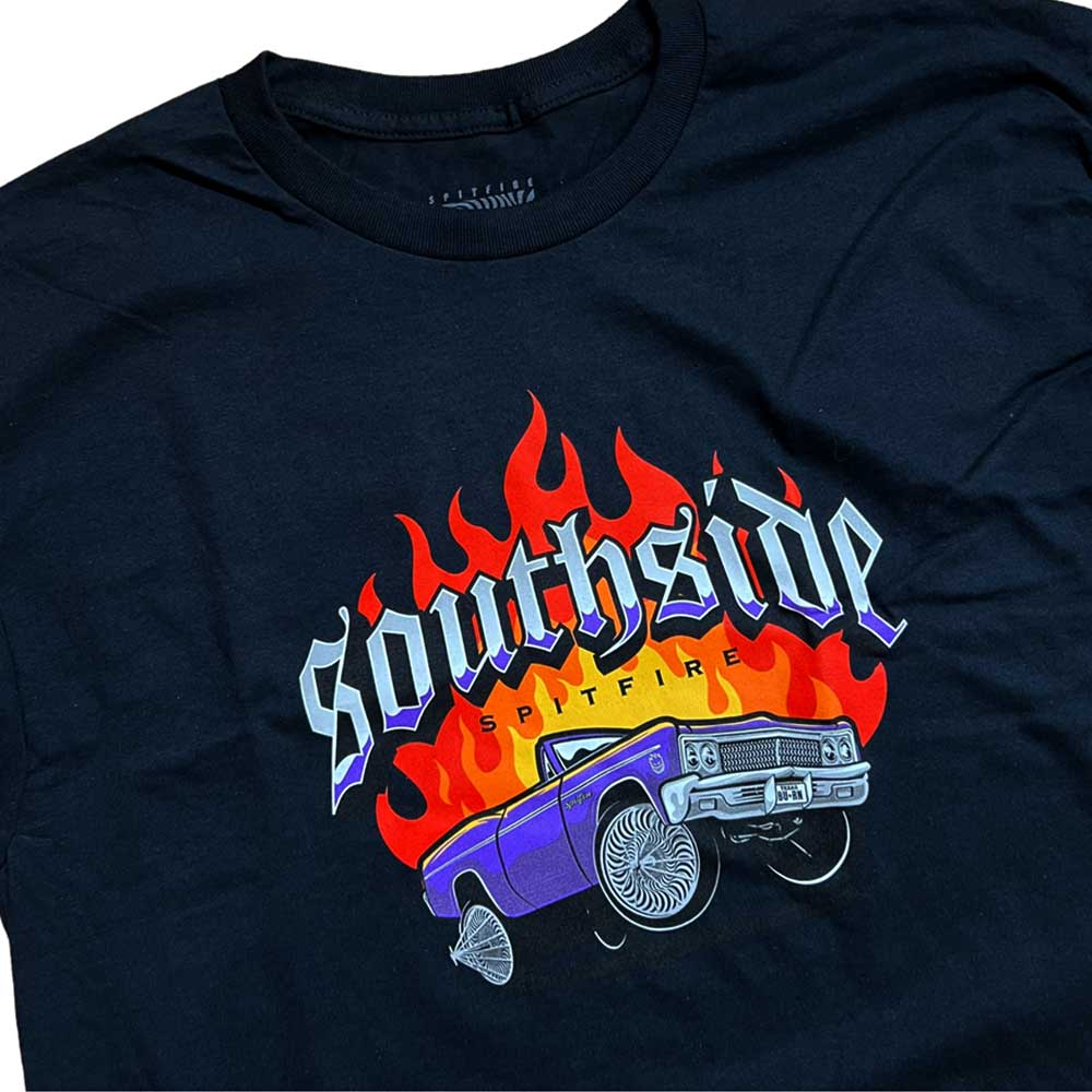 Get a FREE Spitfire Tee x Southside Skatepark with F4 OG Classics 54mm99A White Spitfire Wheels—black tee features a purple classic car, spinning rims, red flames, and "Southside" above "Spitfire.