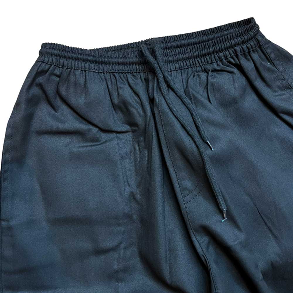 Close-up of Texas Icon Black Southside 94 Pants—loose-fitting skate pants with a satin finish, elastic waistband, and drawstring tie, inspired by classic Southside skating style.