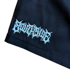 A close-up of black fabric with stylized, jagged white text embroidered in a gothic font reading CULTSIRUS at the corner—featured on Texas Icon Black Southside 94 Shorts.