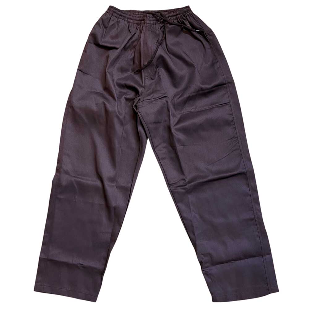 The Texas Icon Brown Southside 94 Pants are loose-fitting skate pants in dark brown, featuring an elastic waistband and drawstring, shown flat on a white background.