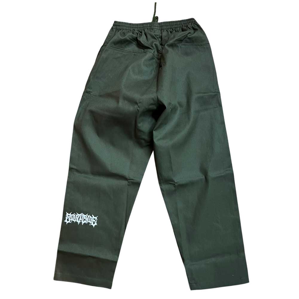 The Texas Icon Dark Green Southside 94 Pants are dark green drawstring skate pants with a wide leg fit and a white graphic text logo on the lower left leg, displayed flat on a white background.