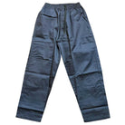 The Texas Icon Gray Southside 94 Pants are loose-fitting, rugged gray pants featuring an elastic waistband with drawstring, visible seams, and lightweight fabric, shown laid flat on a white background.