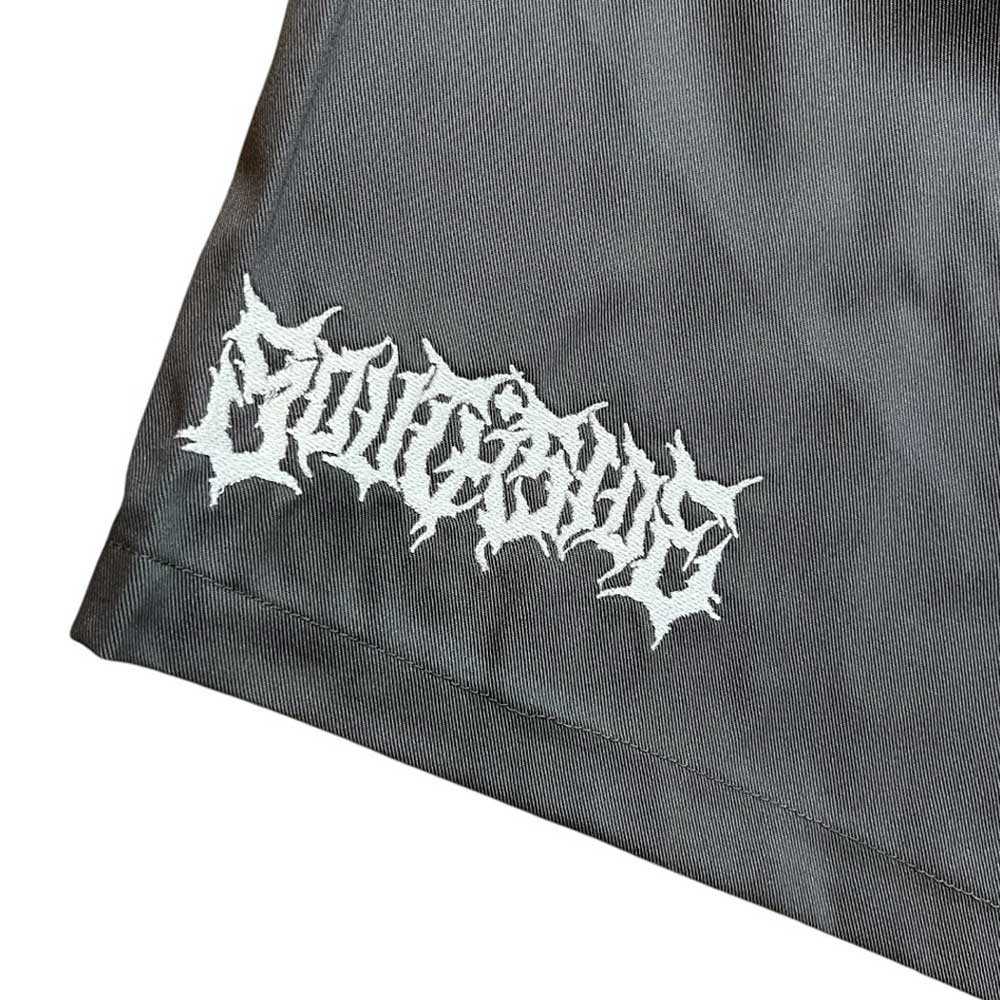 A close-up of Texas Icon Gray Southside 94 Shorts featuring "SAUCEAGE" embroidered in white gothic lettering in the corner.