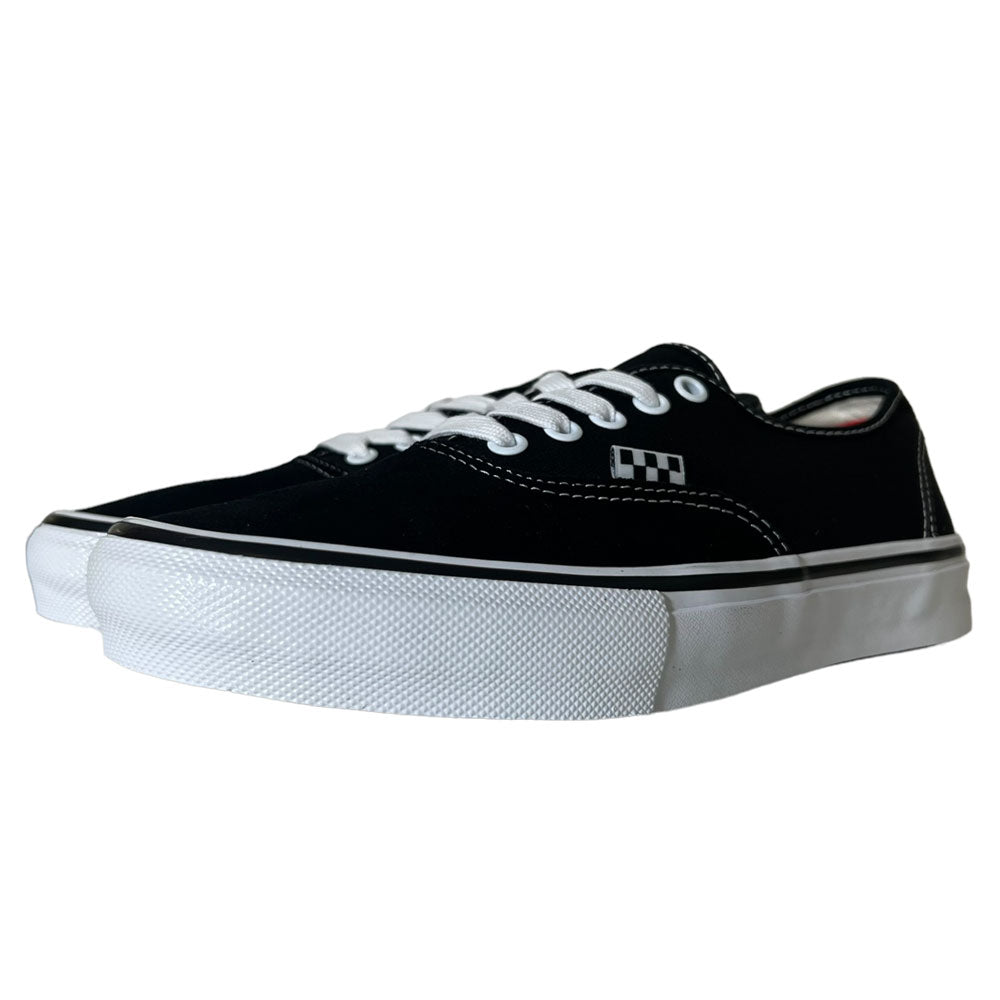 The VNOA5FC8Y28 Suede Canvas Black White Authentic Vans Skateboarding Shoes feature black and white suede, low-top design, white laces and stitching, thick rubber soles, and a subtle checkerboard detail near the laces.