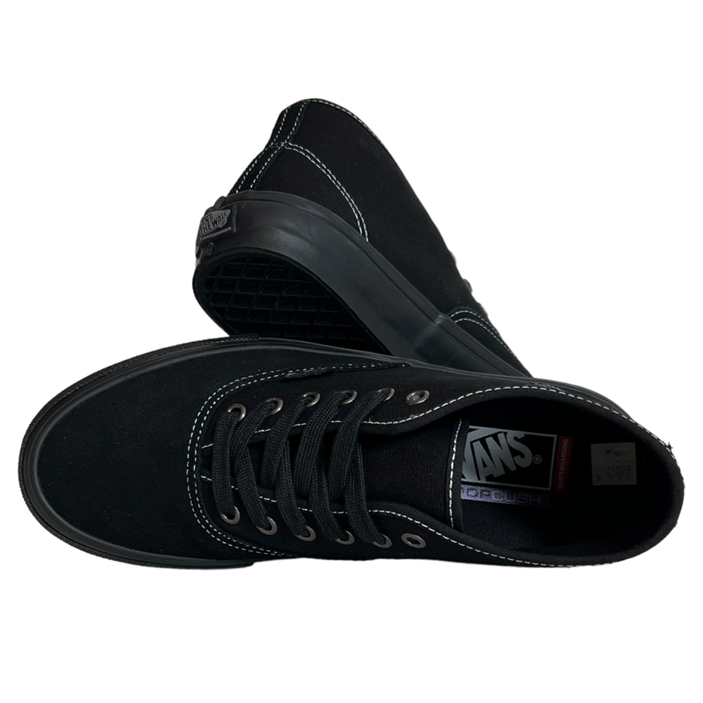 The VN0A27371OJ Suede Black Authentic Mid Vans Skate Shoes feature black suede, black laces, white stitching, a visible Vans logo on the tongue, and a sole with durable PopCush cushioning. One shoe stands upright, the other shows the cushioned sole.